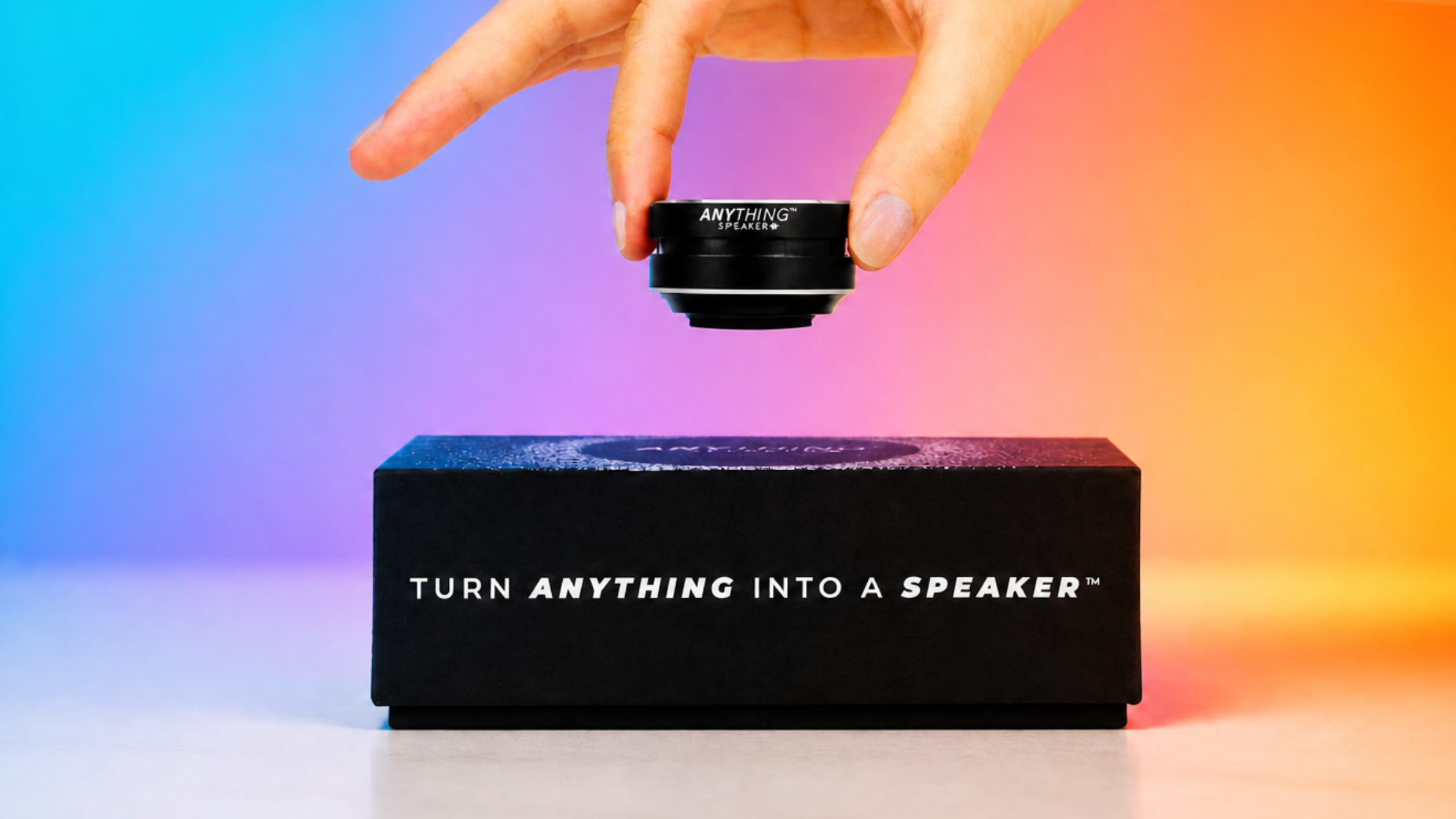 Anything Speaker next to its packaging and another speaker